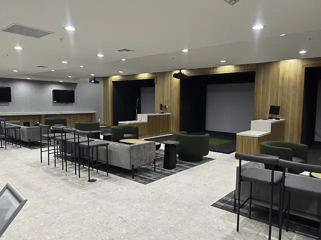 Modern lounge area with seating and wooden accents.