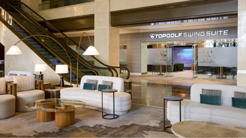 Interior view of a modern lounge area at Topgolf Swing Suite.
