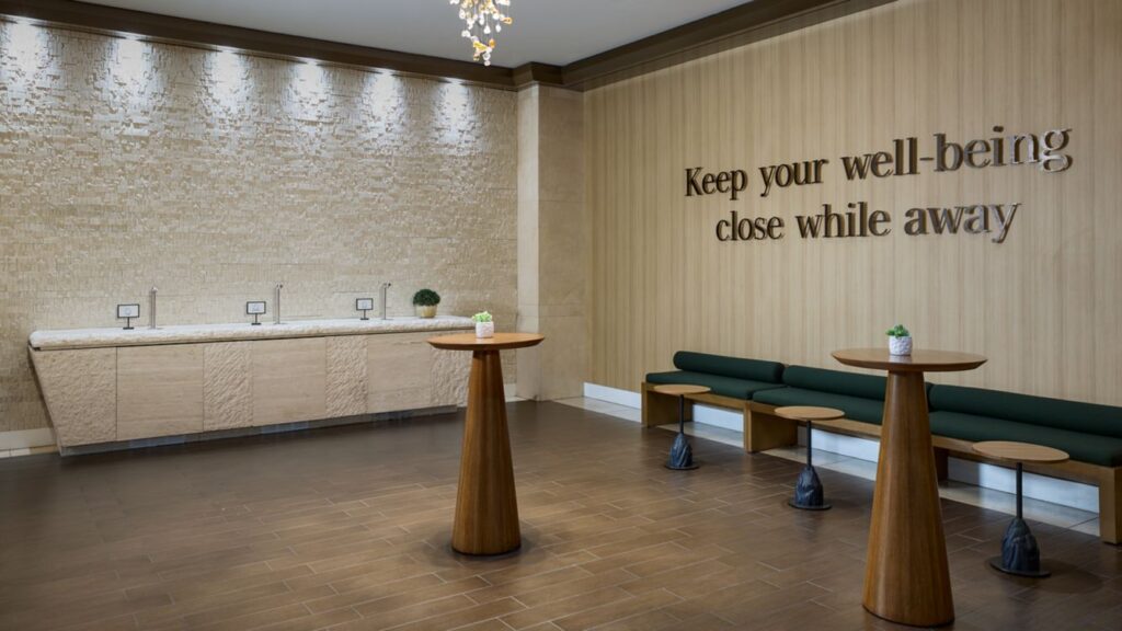 Modern waiting area with seating and a wooden table.